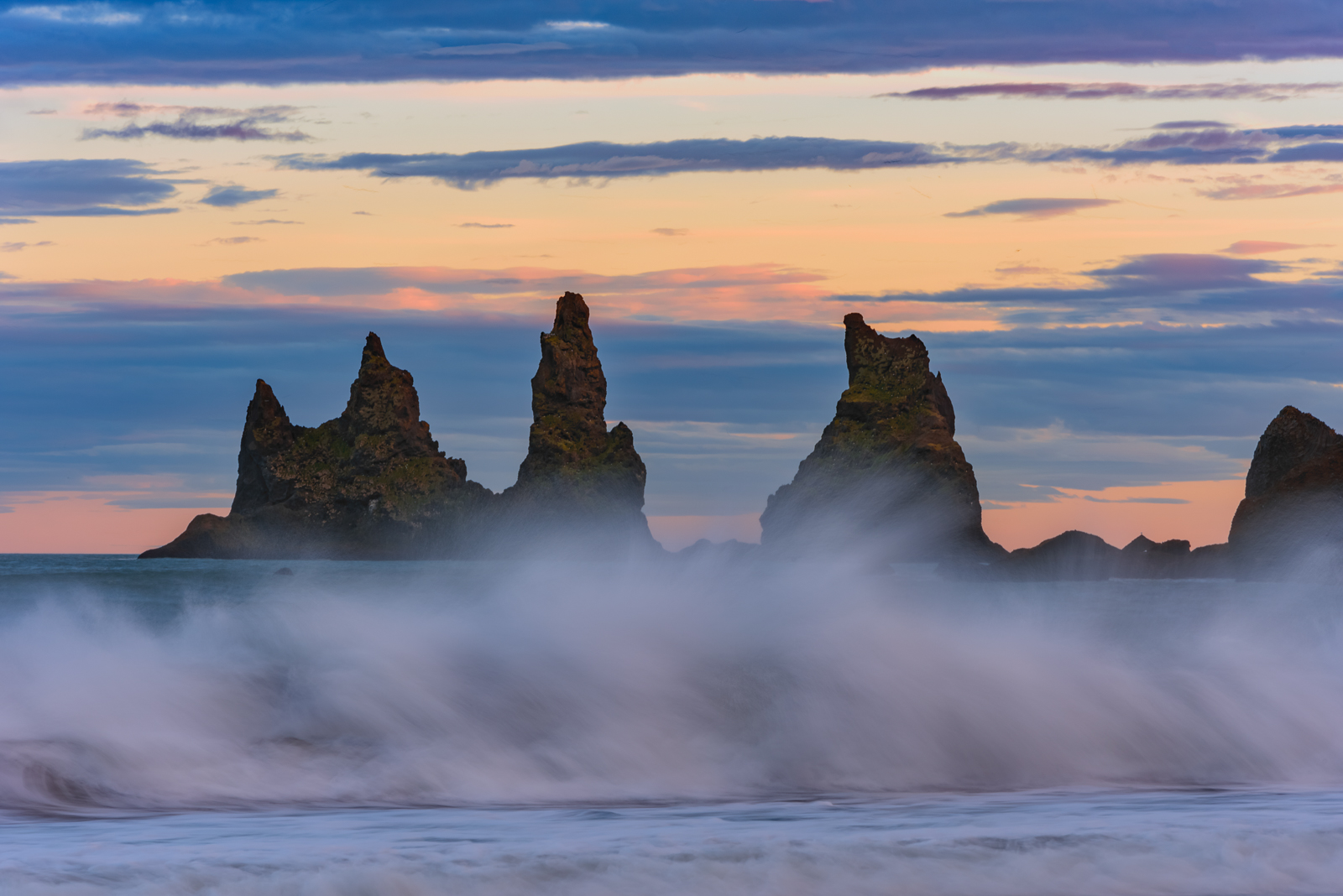 Basalt sea stacks situated under the mountain Reynisfjall near the village Vík, Mýrdal, southern Iceland