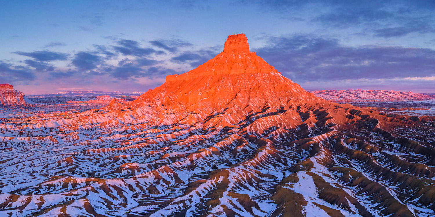 Factory Butte after a recent winter snowfall in the San Rafeal Swell of Southern Utah.