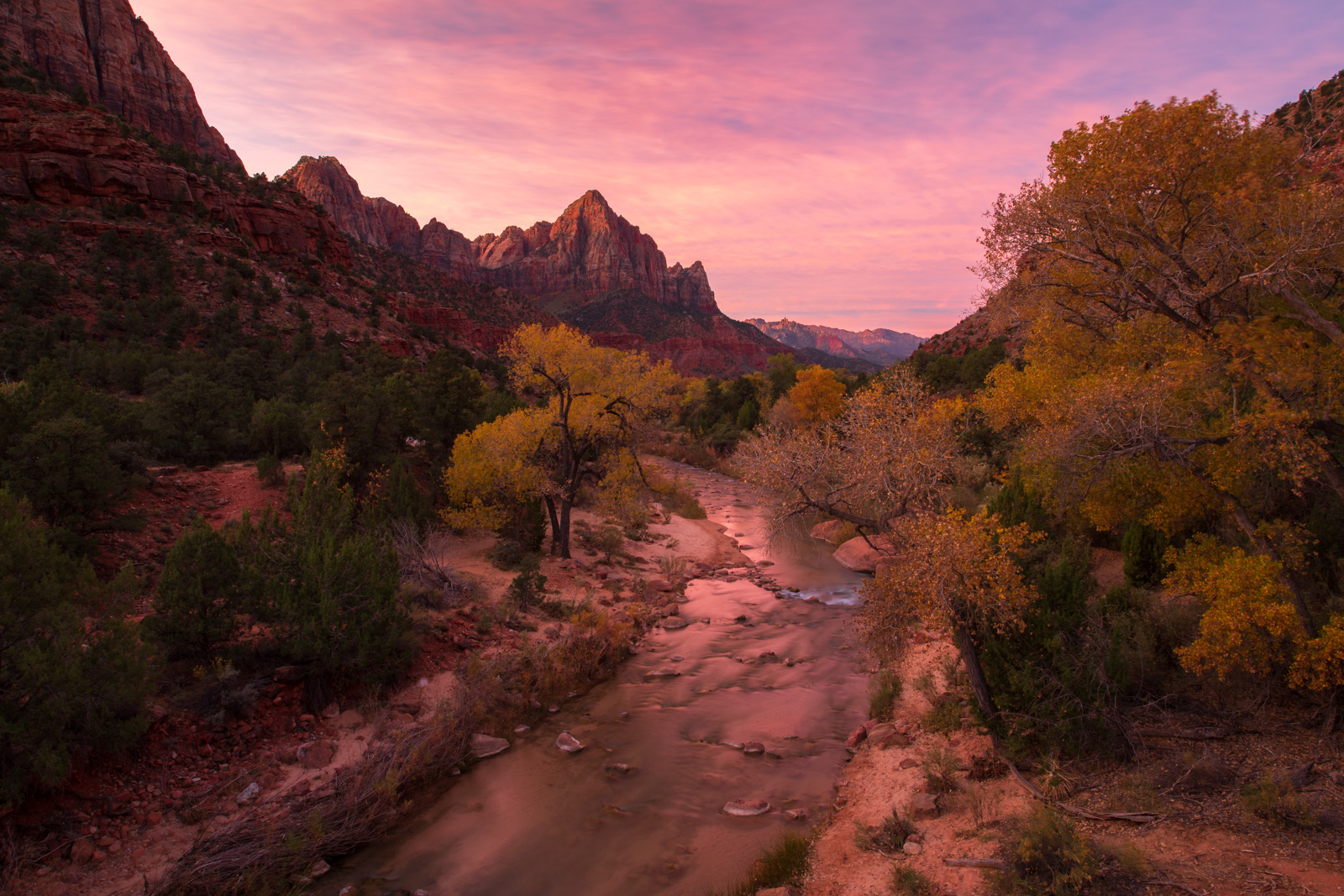 Sunset over the Virgin River with the Watchman in the distance.